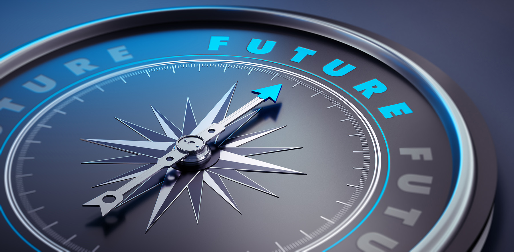 Photograph shows a compass needle pointing toward the word “future.”
