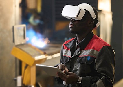 Young African American male with headset and tablet