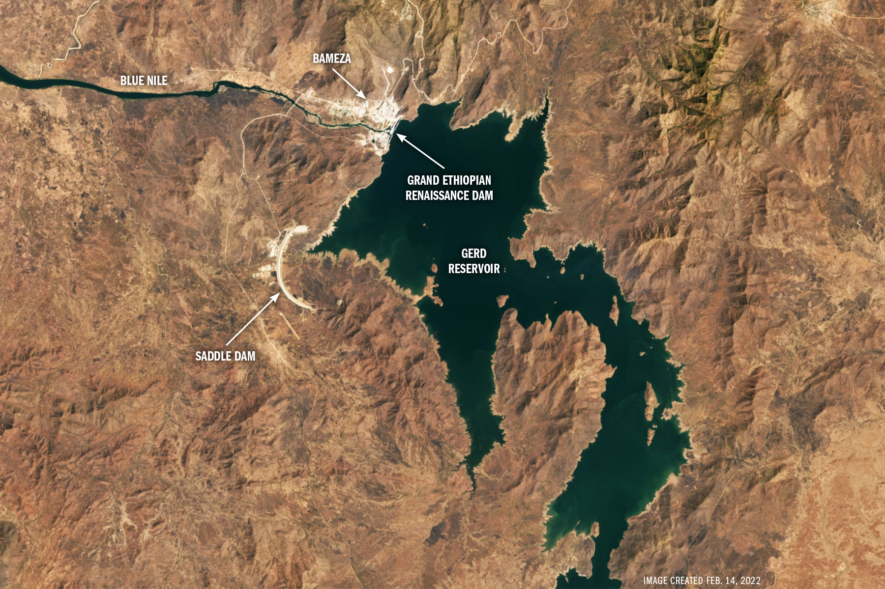 An overhead photograph marks the location of the main dam, the saddle dam, the reservoir, and the Blue Nile river.