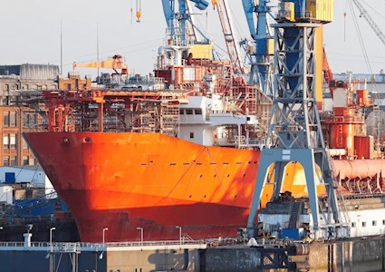 Commercial shipping vessel in a dry dock 