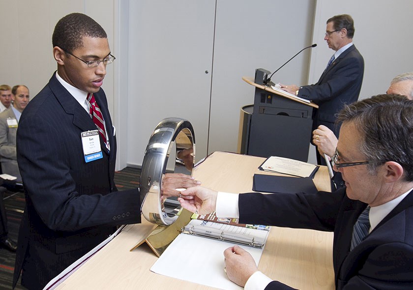 Sam Oke receives Order of the Engineer ring from President DiLoreto.