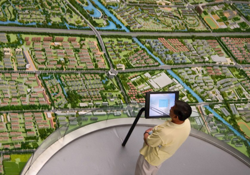 Surveyor assessing landscape with an aerial view