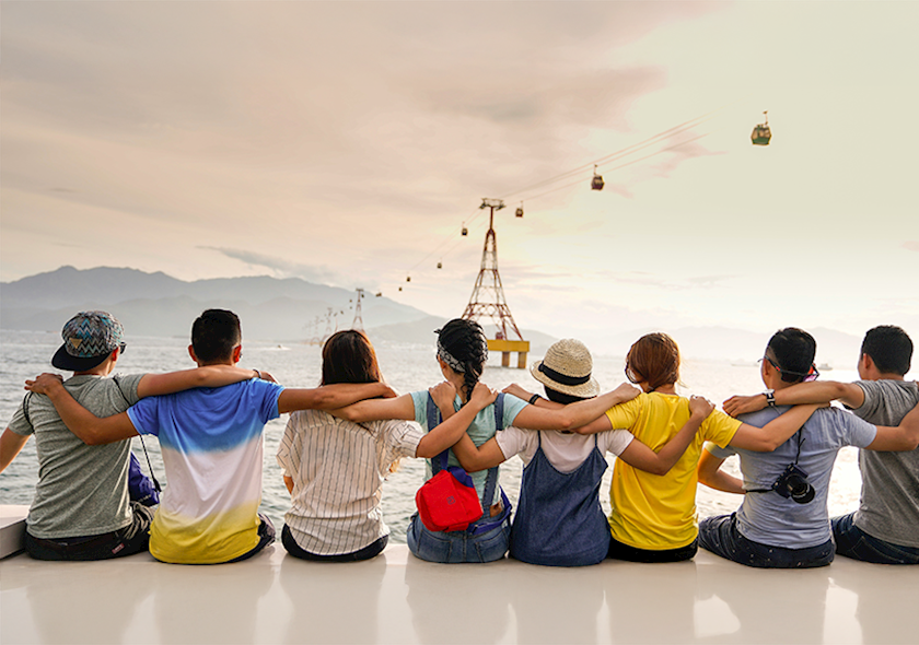 Group of people locking arms